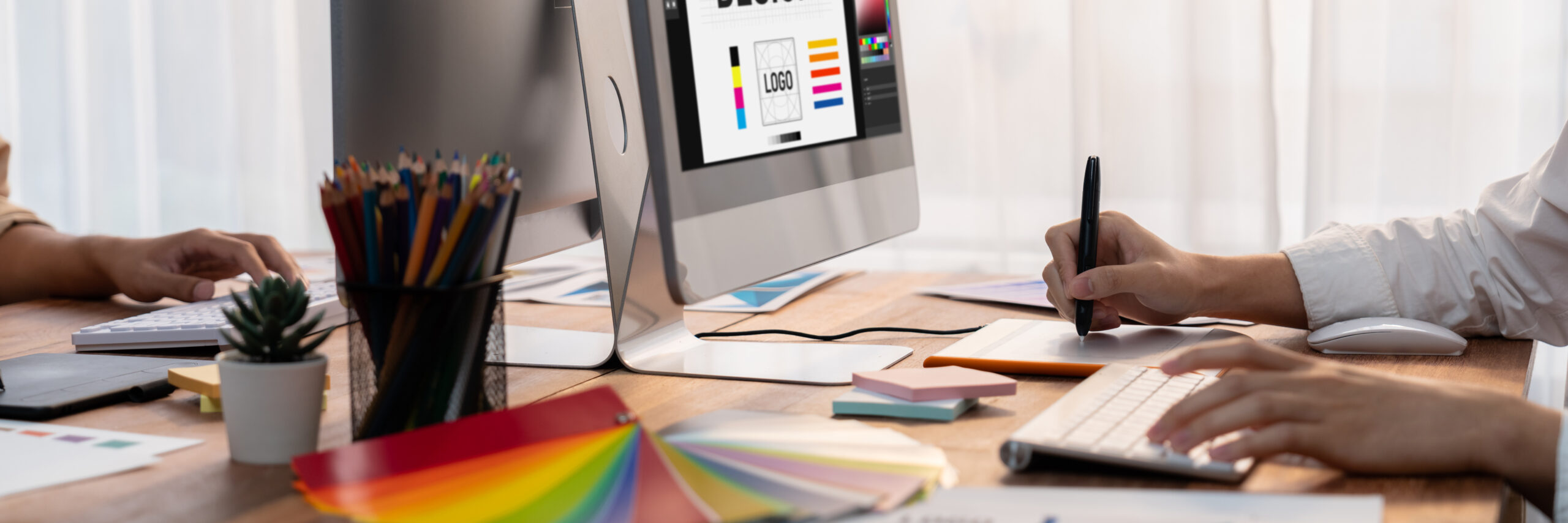 A member of our graphic design team working on a brand identity project.